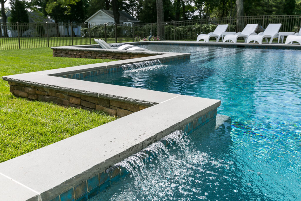 custom backyard pool with water features
